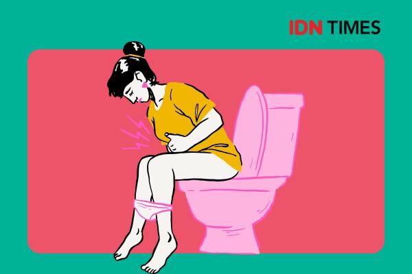 Seorang perempuan tampak kesakitan saat buang air besar.