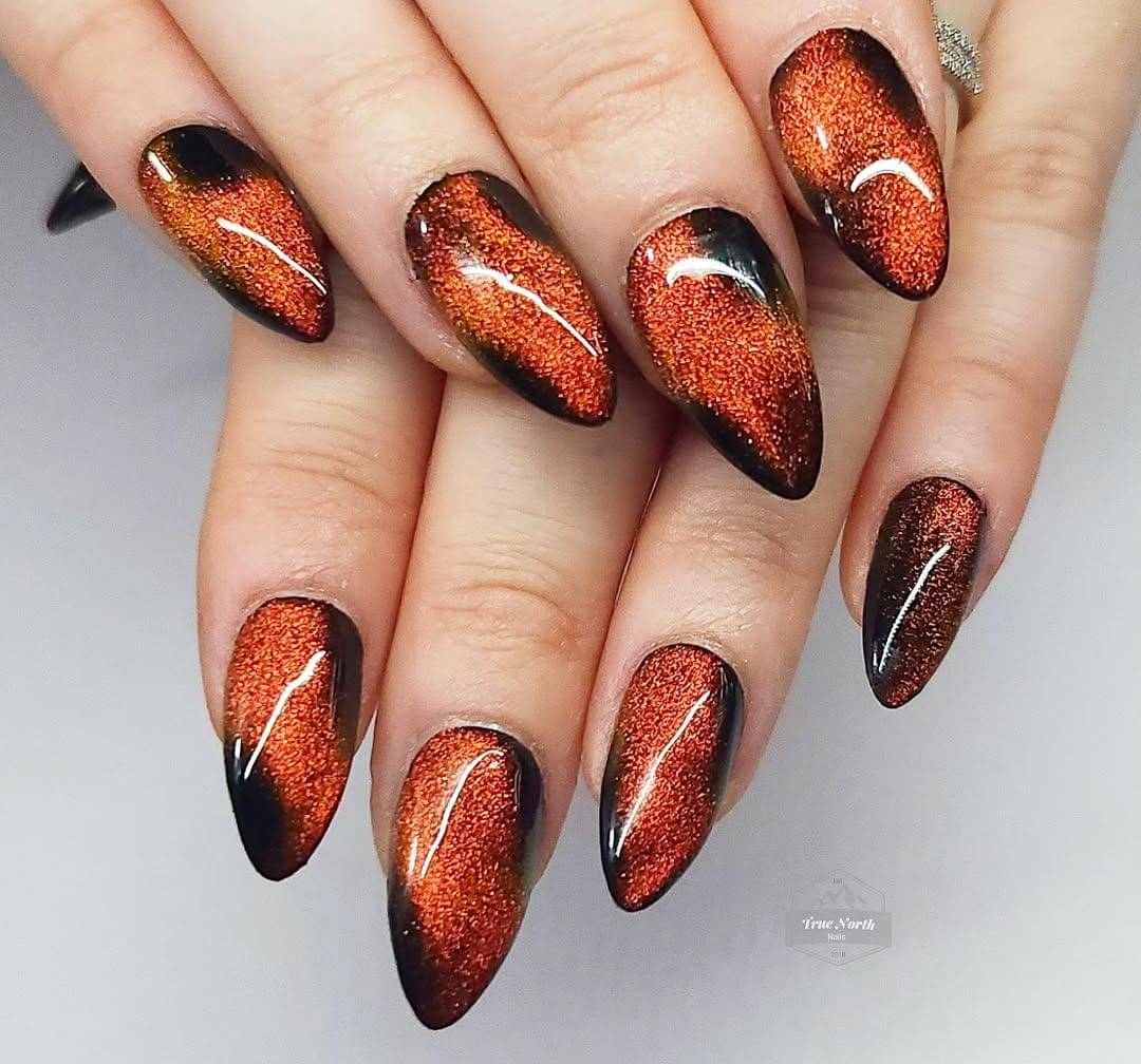 Ide nail art cat-eye orange (instagram.com/truenorthnails)
