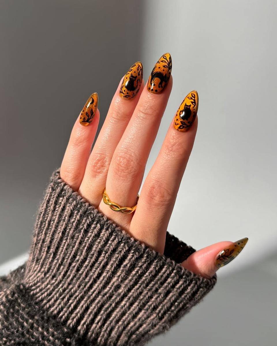 Ide nail art cat-eye orange (instagram.com/thecolornook)