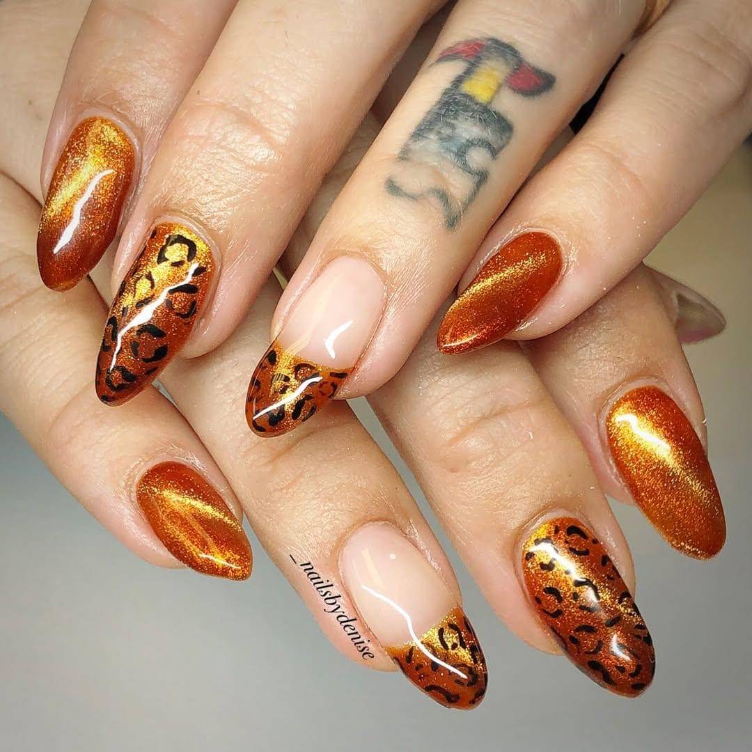 Ide nail art cat-eye orange (instagram.com/_nailsbydenise)