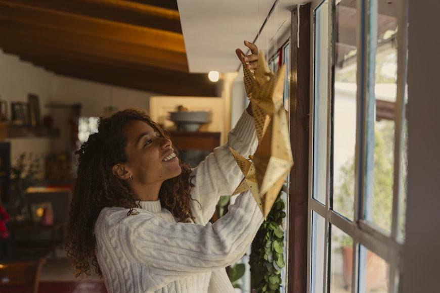 https://unsplash.com/photos/a-woman-is-looking-out-a-window-and-smiling-fKYp8zeus-s