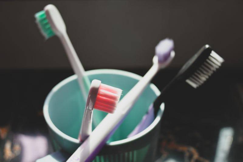 https://unsplash.com/photos/two-toothbrushes-in-a-cup-with-toothpaste-ED3F5UhUv5s