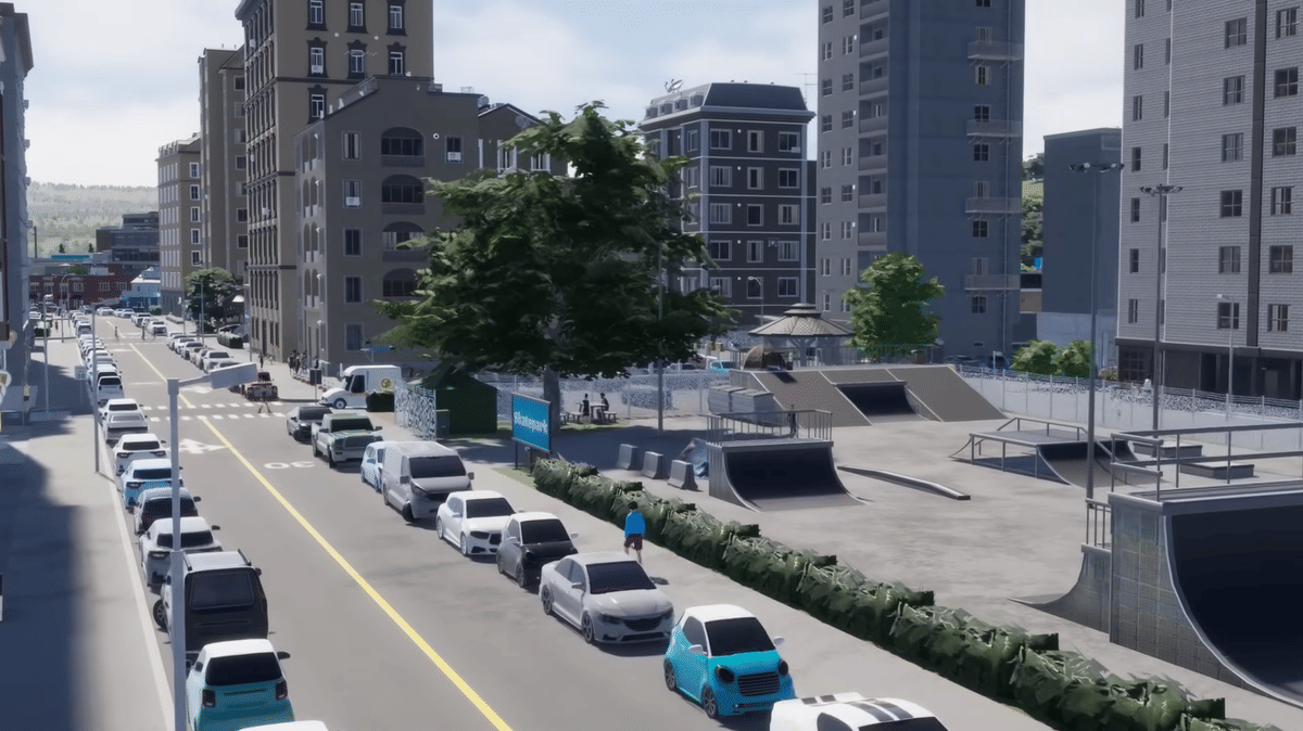 Deretan mobil parkir di pinggir jalan kota virtual dengan gedung tinggi di sekitarnya dan area skatepark di sisi kanan jalan.