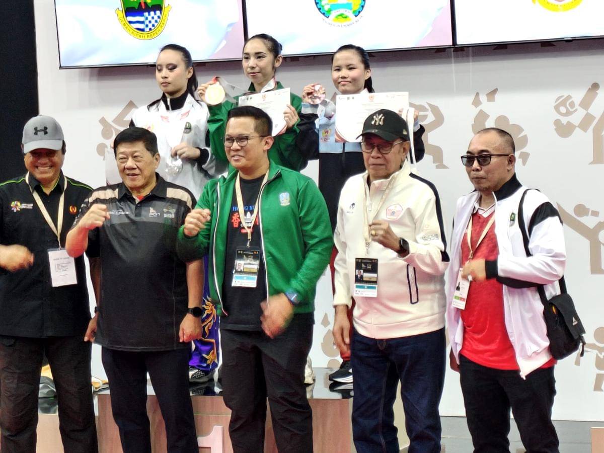 Kelly (kanan) meraih perunggu wushu nomor Gun Shu (dok.SIWO PWI Sumut)