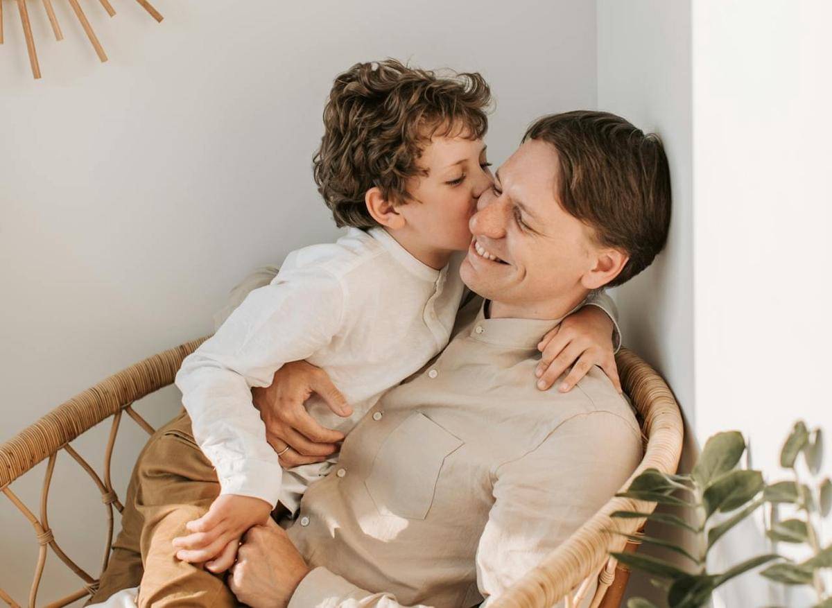https://www.pexels.com/photo/father-getting-a-kiss-on-the-cheek-from-his-son-4609082/