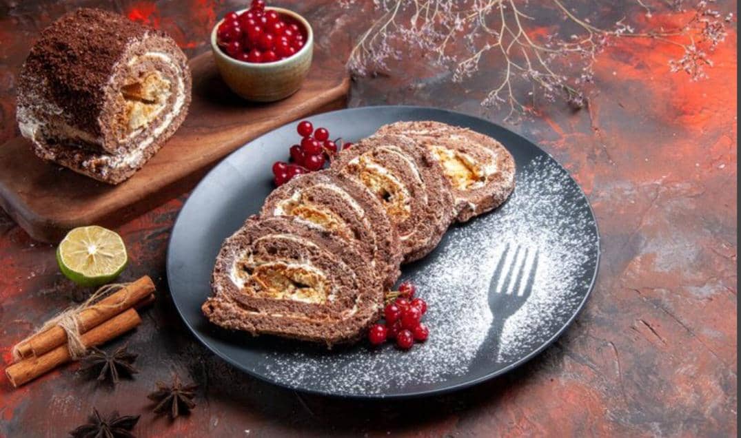 ilustrasi yule log cake (freepik.com/KamranAydinov)