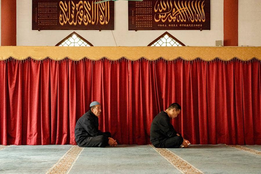 https://www.pexels.com/photo/two-men-praying-in-a-mosque-with-red-curtains-30692228/
