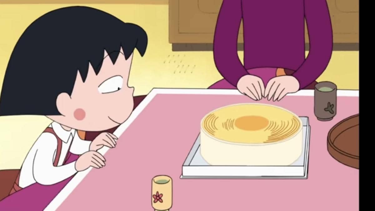 Maruko chan memandang kue baumkunchen dengan berbinar