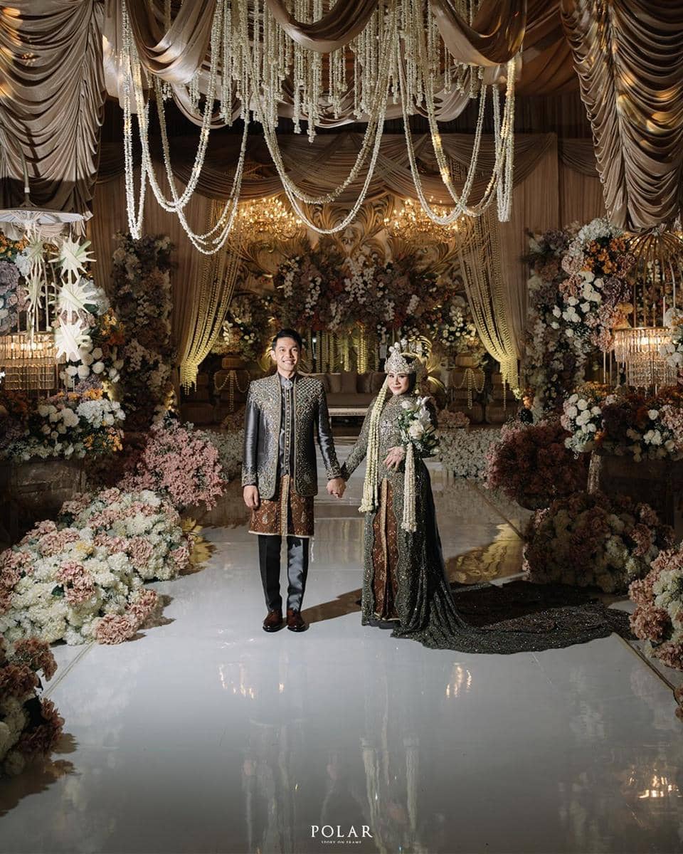 A touch of luxury, a breath of warmth, and a love that feels just right. - Firly & Fajar -Weddi.jpg
