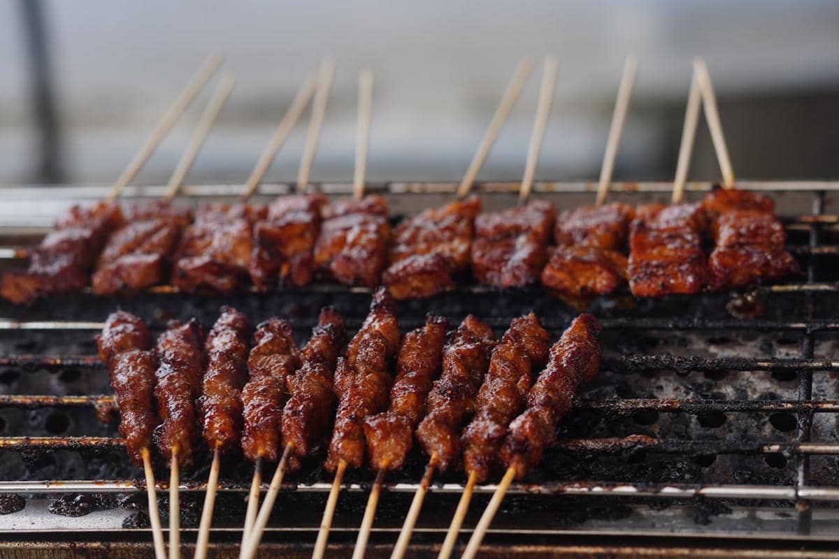 https://www.pexels.com/photo/delicious-skewers-grilling-over-charcoal-fire-34447950/