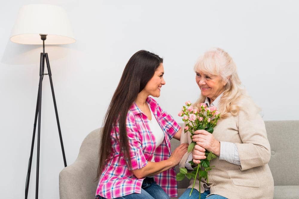 ilustrasi perempuan memberi bunga untuk ibu