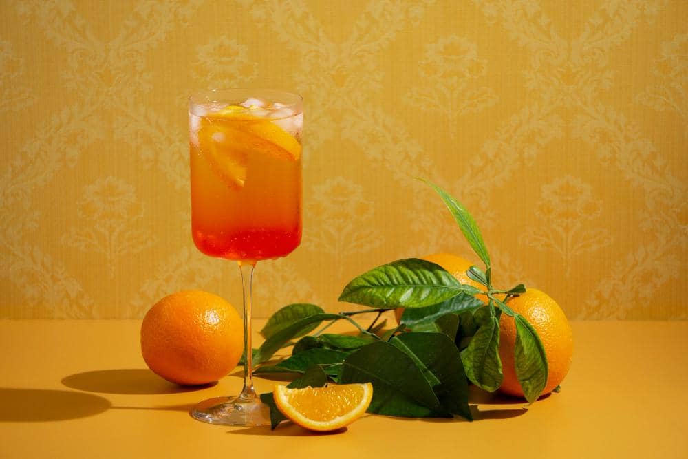 ilustrasi mocktail orange sunrise mocktail