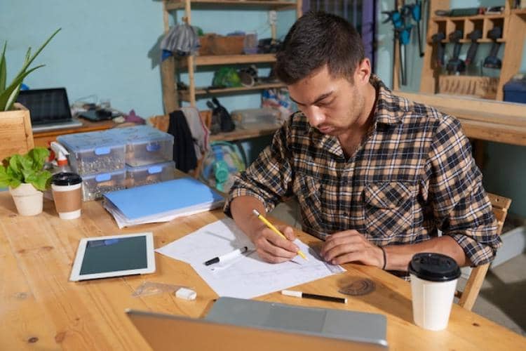 ilustrasi pria membuat kado Natal DIY