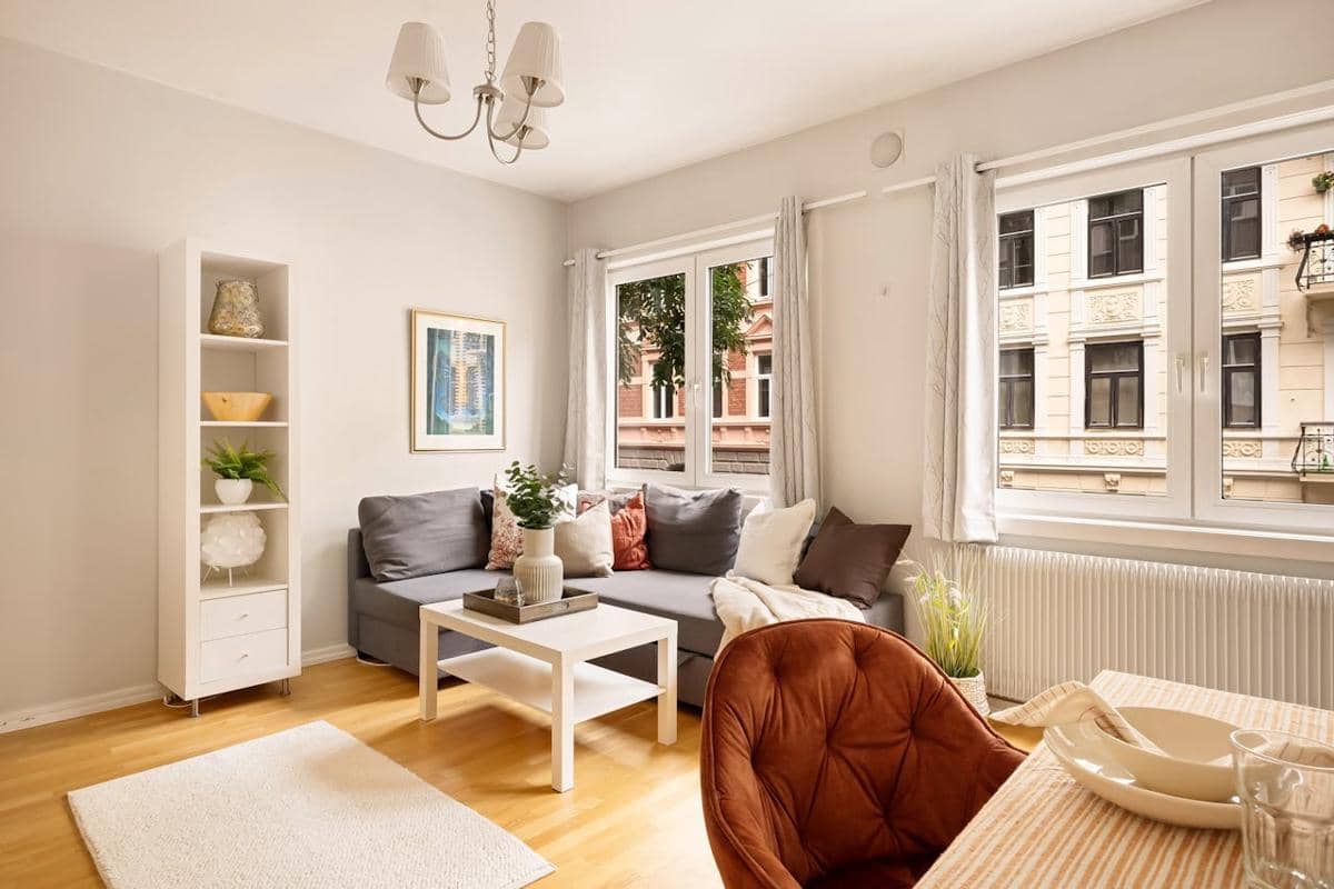 https://www.pexels.com/photo/tables-armchair-and-couch-in-living-room-19899060/