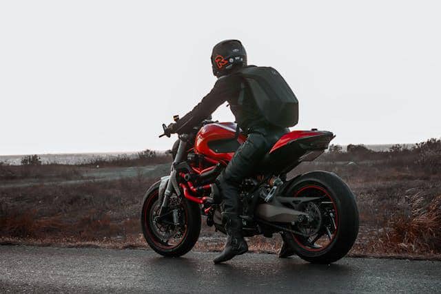 https://www.pexels.com/photo/person-in-black-leather-jacket-and-pants-riding-a-ducati-motorcycle-on-asphalt-road-7564495/