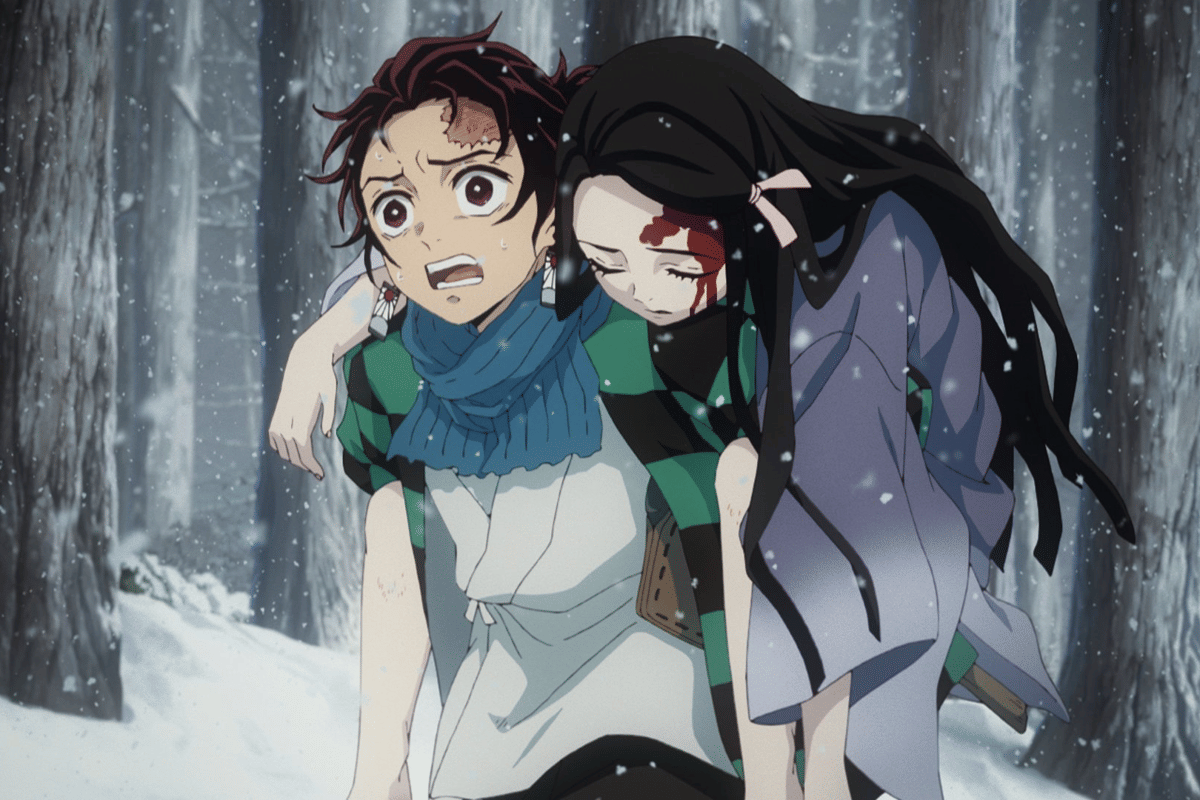 Tanjiro menggendong Nezuko.
