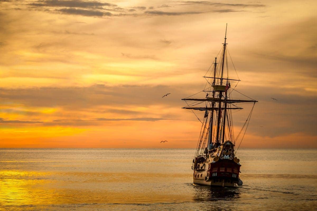 https://www.pexels.com/photo/a-pirate-ship-sailing-on-sea-during-golden-hour-37730/