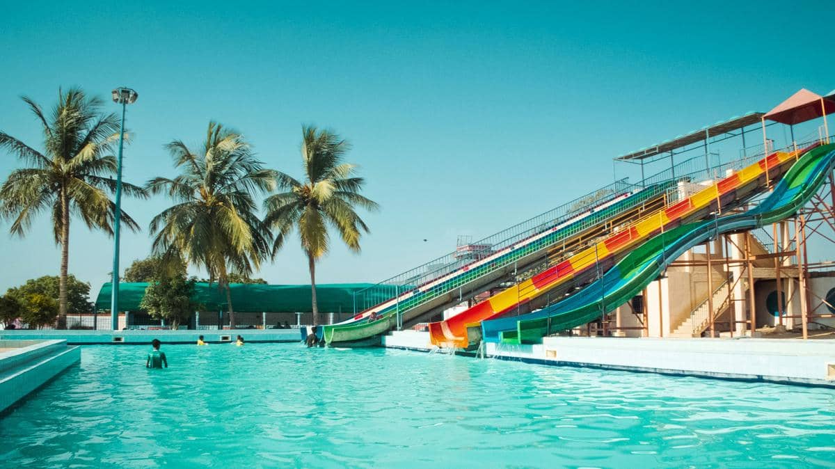 a water slide in the middle of a swimming pool