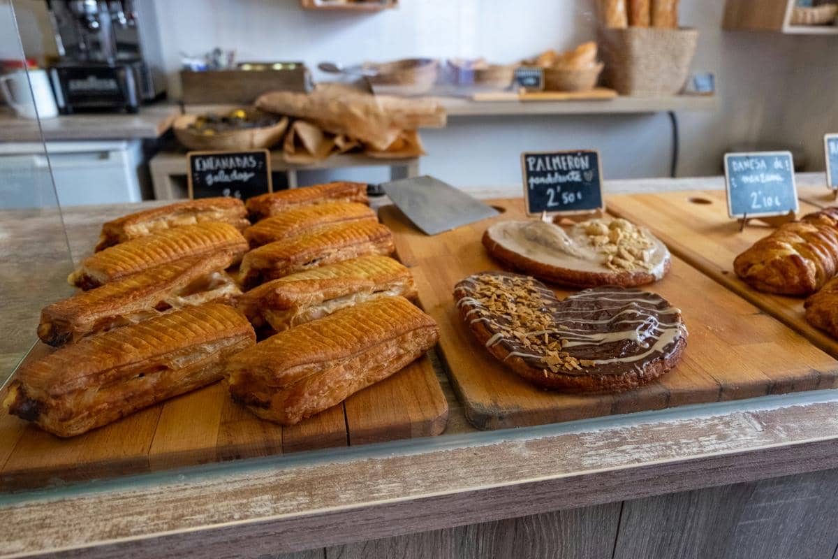 Fresh pastries are displayed in a bakery
