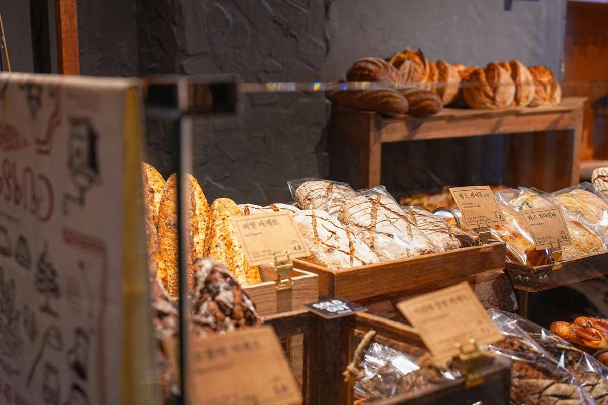 Freshly baked bread displayed in a bakery.