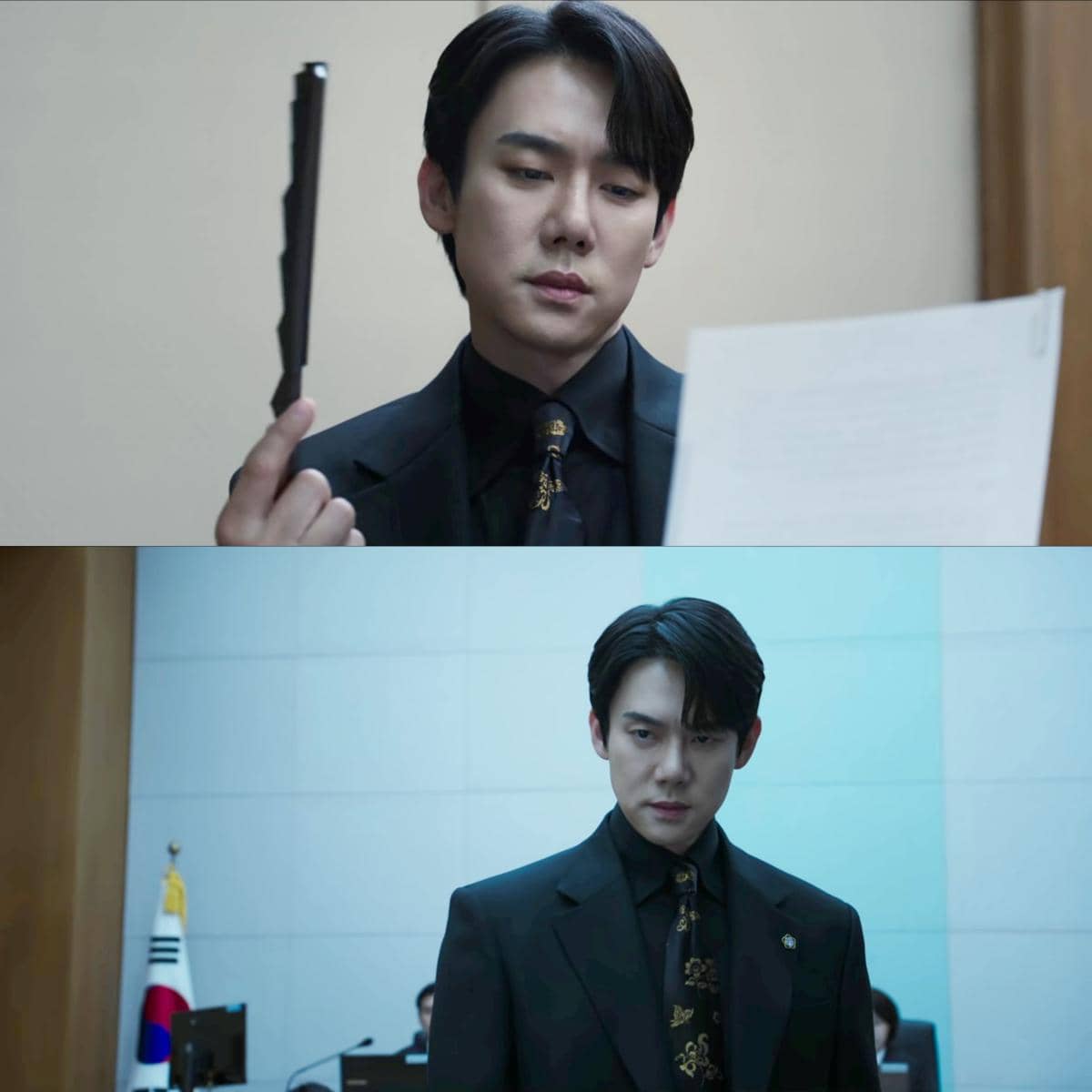 Seorang pria mengenakan setelan jas hitam sedang memegang dokumen dan berdiri di ruang sidang dalam adegan drama Korea Phantom Lawyer.