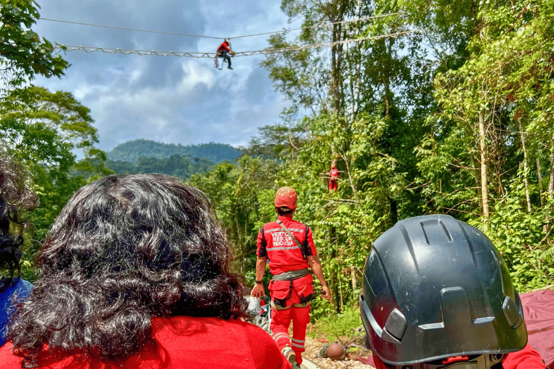 The Vertical Rescue Indonesia team looks on at the canopy bridge during construction_Credit Juang Solala Laiya for SOS.png