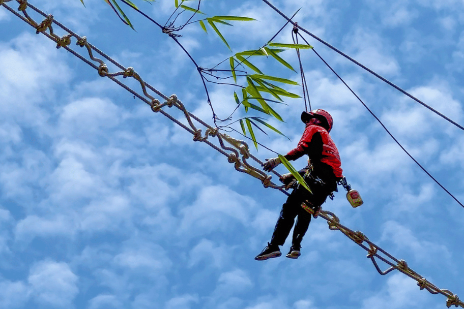 Sitting on the canopy bridge during construction_Credit Juang Solala Laiya for SOS.png