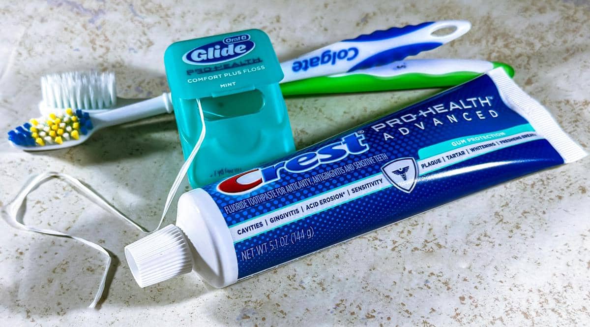 Close up of Dental Floss, Toothpaste and Toothbrushes