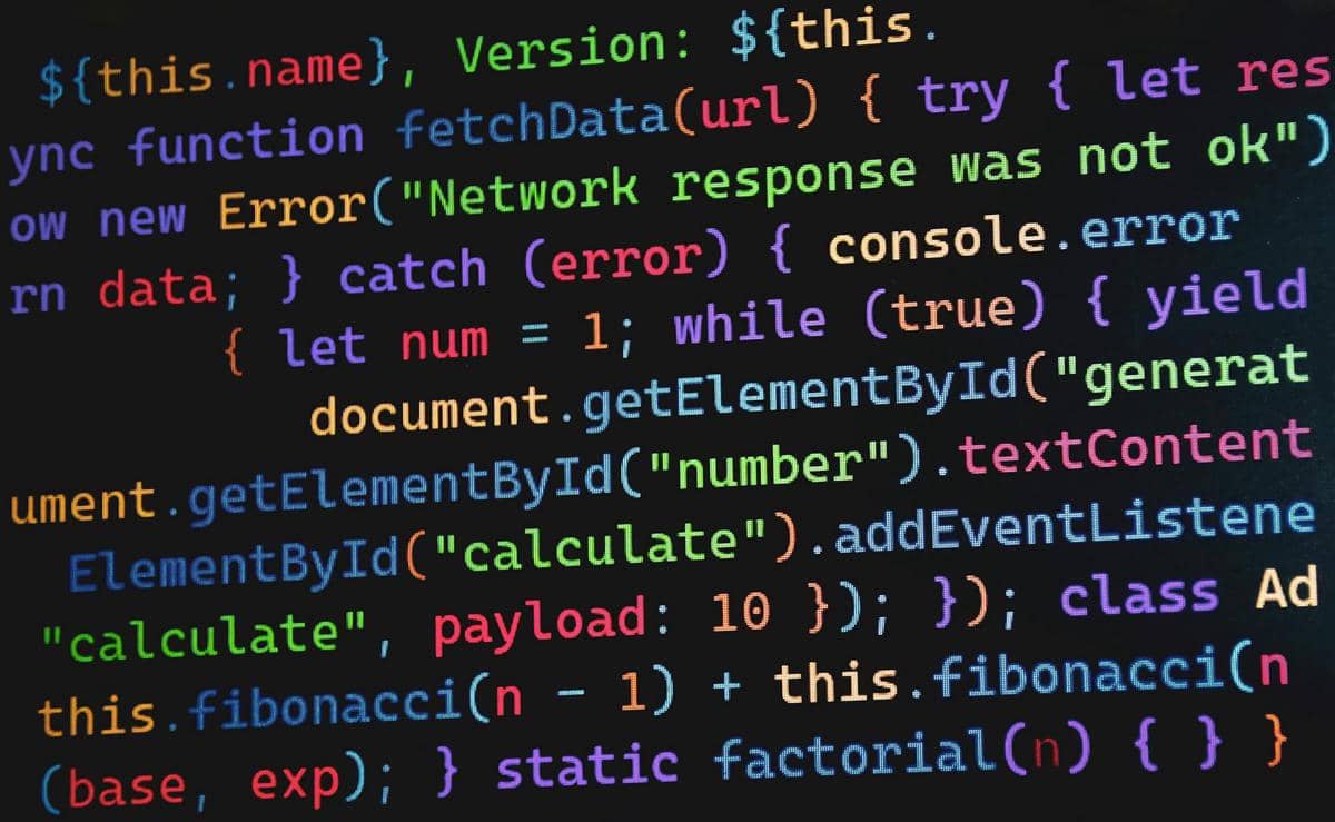 Tampilan layar komputer berisi baris kode pemrograman berwarna-warni yang menunjukkan sintaks JavaScript untuk pengembangan web.