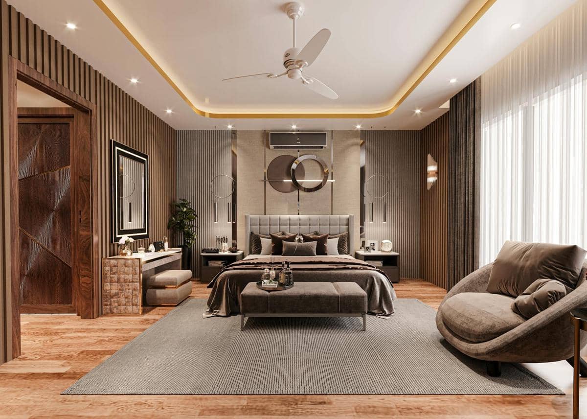 Kamar tidur modern dengan desain elegan, tempat tidur besar berlapis abu-abu, pencahayaan hangat, dan dekorasi dinding bergaya kontemporer.