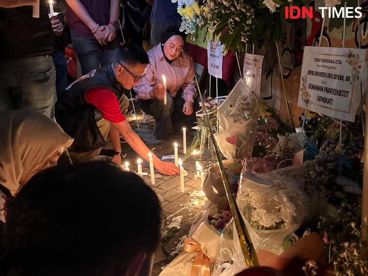 Warga dan Ojol Gelar Aksi Nyalakan Lilin di TKP Penembakan Bripka Arya
