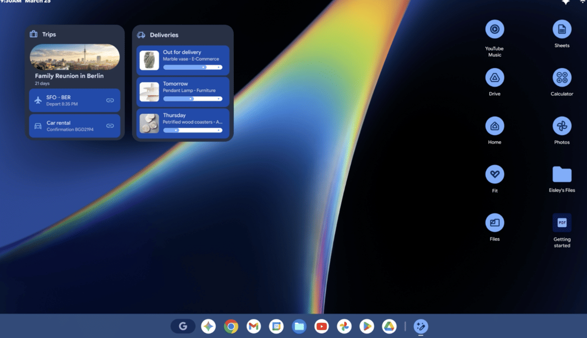 Tampilan antarmuka layar Googlebook dengan widget perjalanan dan pengiriman di sisi kiri serta ikon aplikasi Google di sisi kanan.