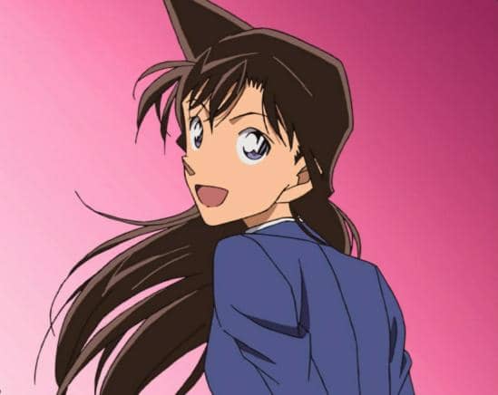 Karakter anime perempuan berambut panjang mengenakan seragam biru dengan latar belakang gradasi merah muda.