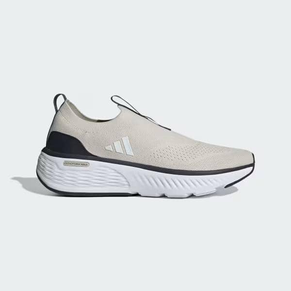 Sepatu Adidas Cloudfoam Go Sock berwarna krem dengan sol tebal putih dan detail hitam di bagian tumit, bergaya slip-on modern.