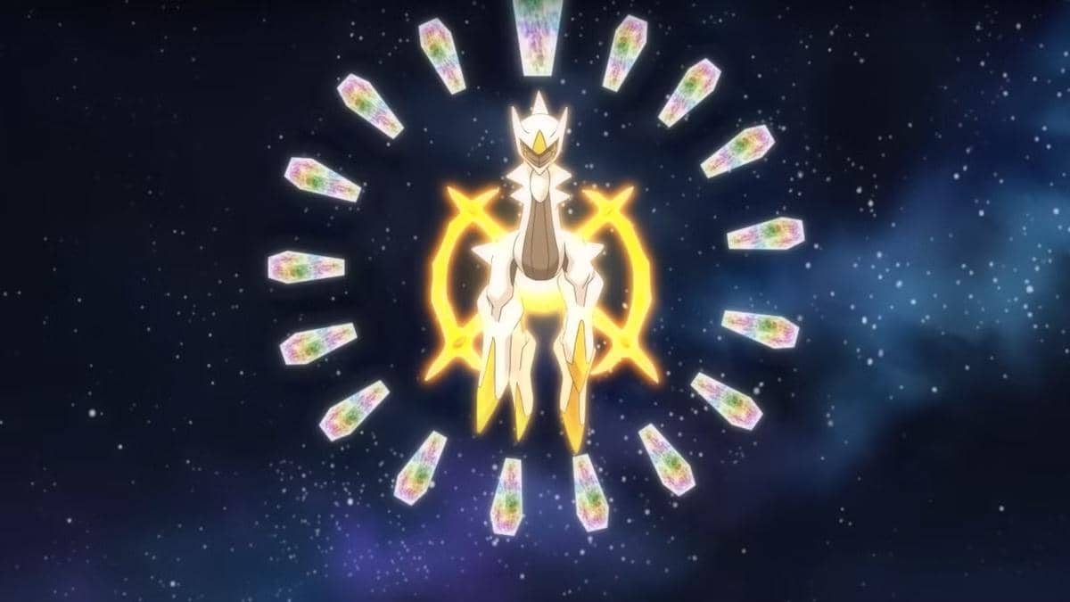 Arceus, makhluk legendaris Pokémon berwarna putih dengan cincin emas bercahaya, melayang di angkasa dikelilingi kristal bercahaya.