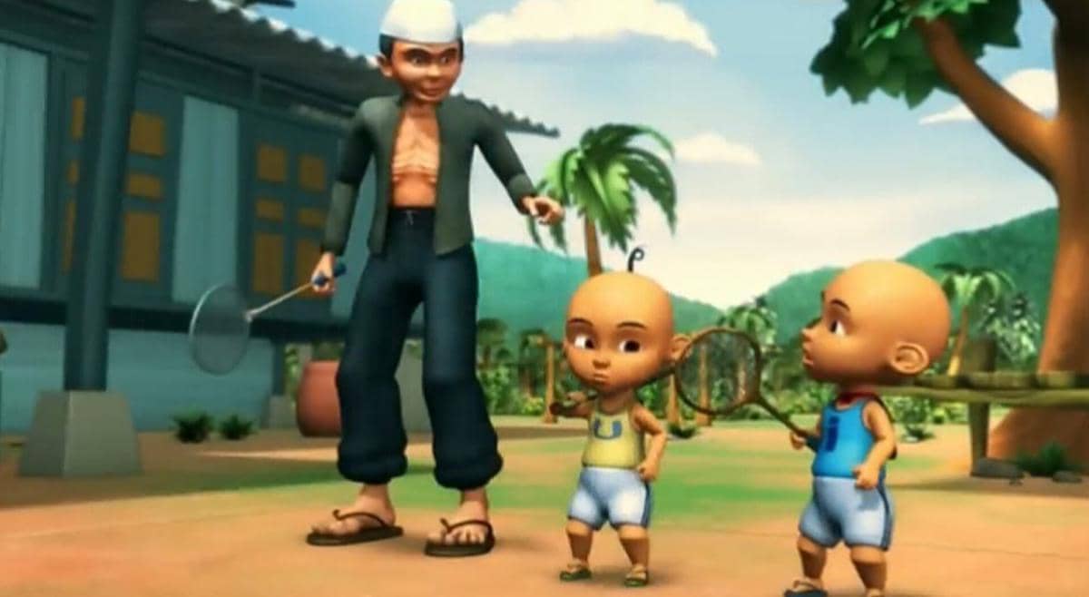Tok Dalang mengajari Upin dan Ipin cara bermain bulu tangkis