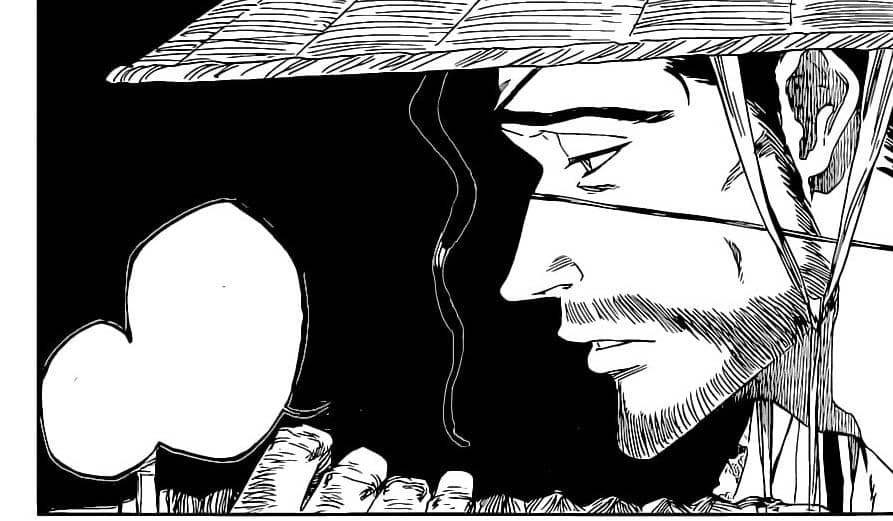 Kyoraku mengenakan topi jerami sedang berbicara dengan ekspresi serius dalam panel manga Bleach hitam putih.