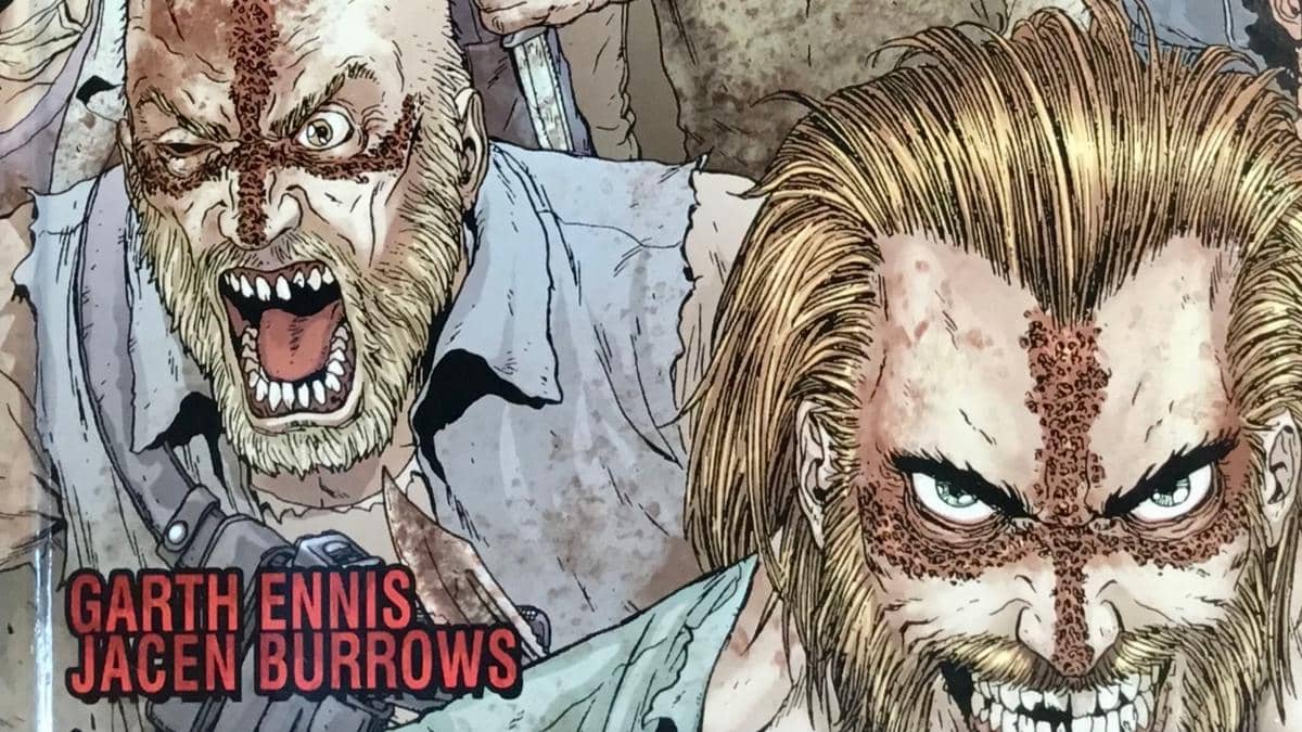 Ilustrasi dua karakter komik dengan wajah penuh luka berbentuk salib dan ekspresi marah, karya Garth Ennis dan Jacen Burrows.