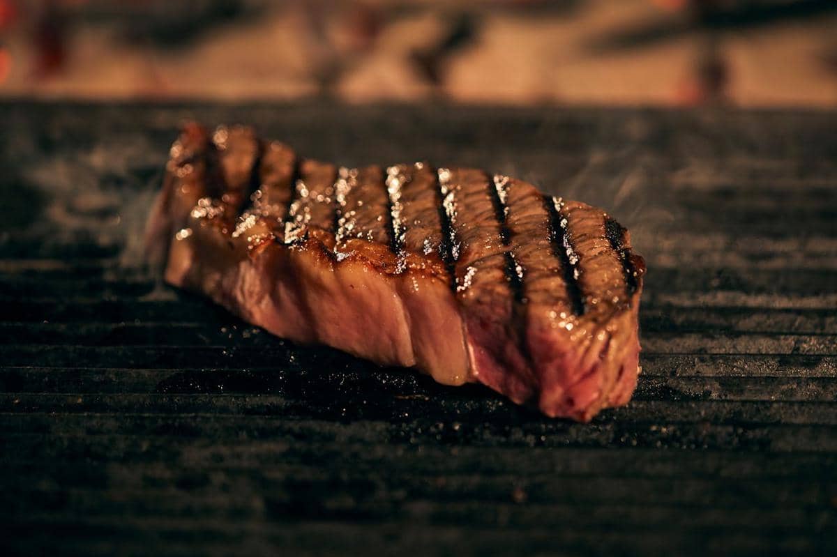 https://www.pexels.com/photo/juicy-grilled-steak-sizzling-on-bbq-36683024/