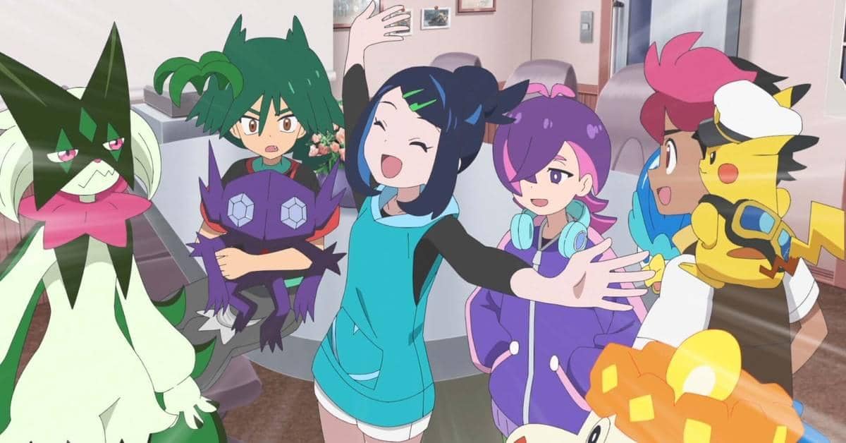 Para karakter anime Pokemon Horizons berkumpul dengan ekspresi ceria bersama beberapa Pokemon di dalam ruangan yang terang.