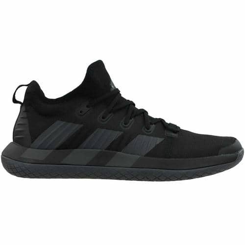 Sepatu olahraga Adidas Stabil Next Gen berwarna hitam dengan desain modern dan sol tebal untuk kenyamanan maksimal.