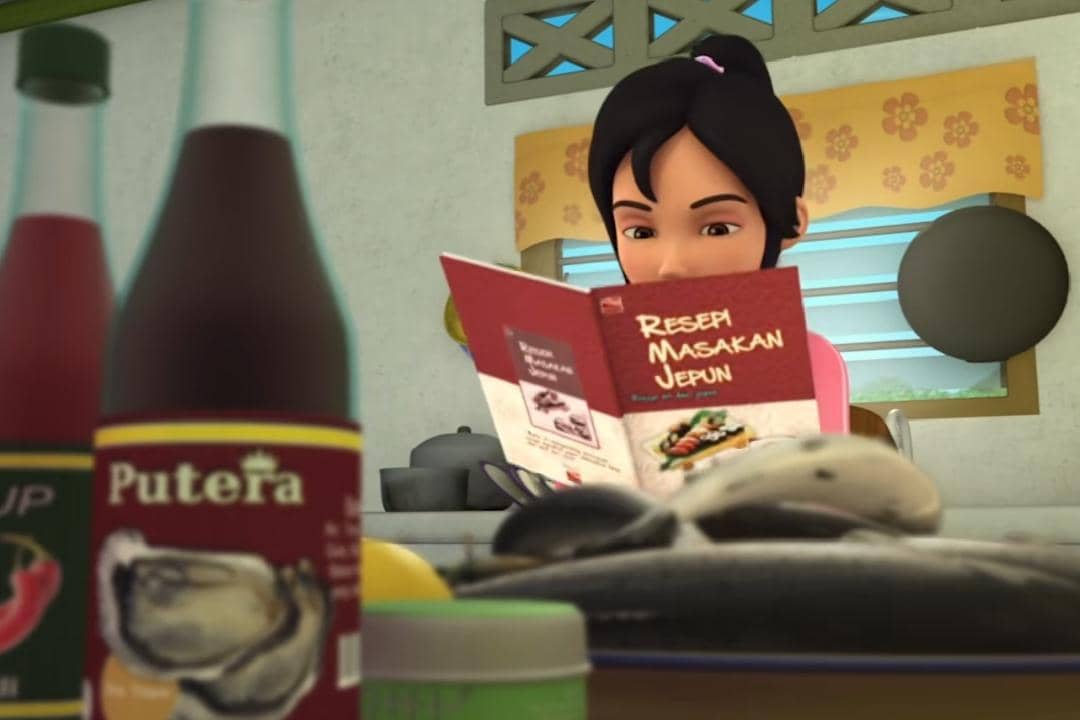 Kak Ros sibuk membaca buku Resepi Masakan Jepun supaya pandai membuat Sashimi