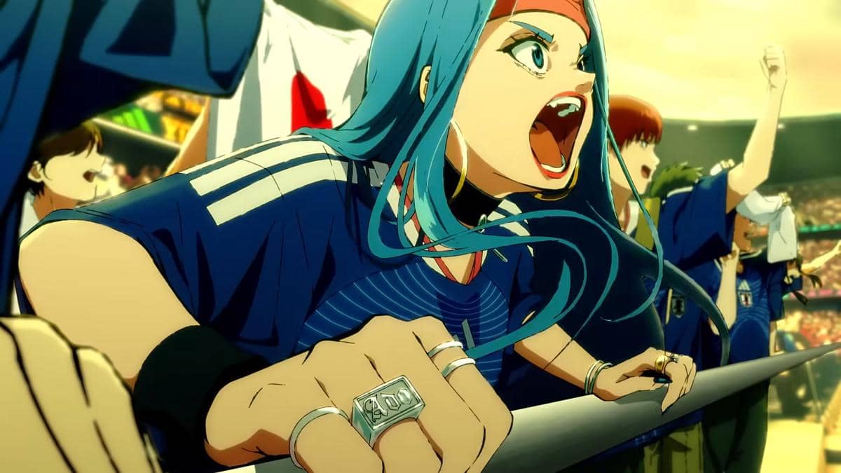 Karakter anime berambut biru mengenakan jersey timnas Jepang bersorak di stadion dengan latar bendera Jepang dan penonton.