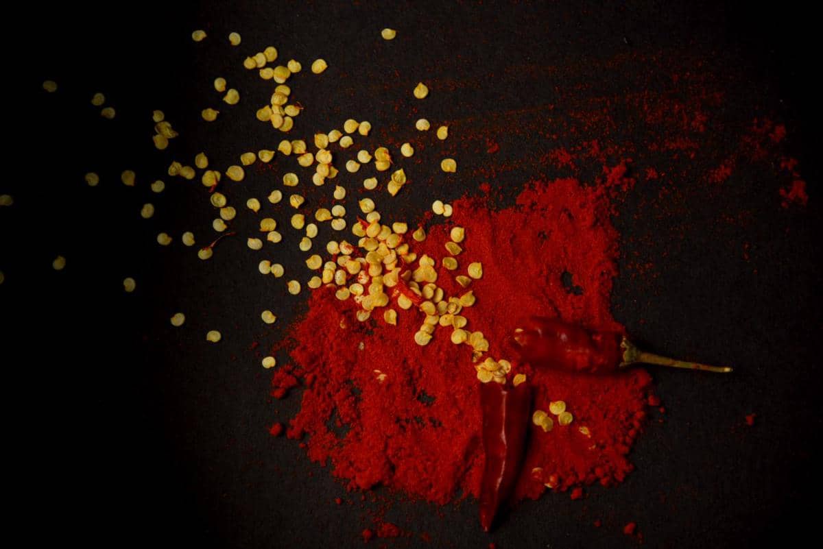 https://www.pexels.com/photo/spicy-chili-powder-and-seeds-on-black-background-33440718/