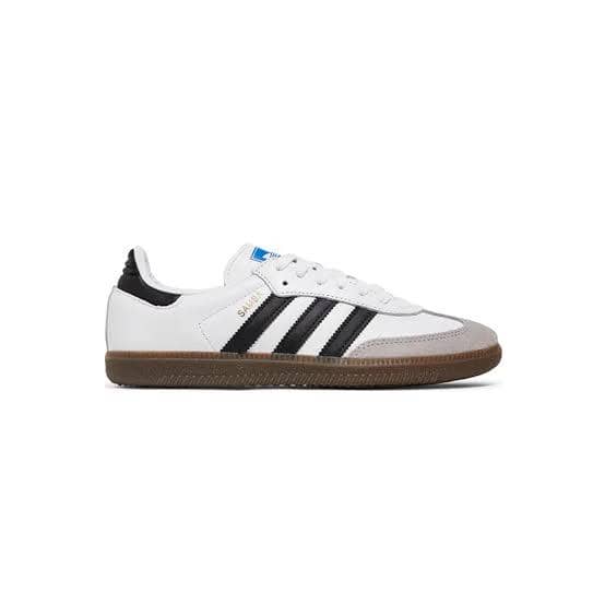 Sepatu Adidas Samba berwarna putih dengan tiga garis hitam dan sol karet cokelat, menampilkan desain klasik dan sporty.
