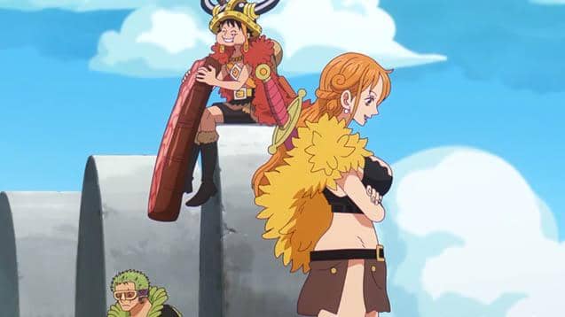 Luffy, Nami, dan Zoro mengenakan kostum unik sedang menuju istana di bawah langit cerah dalam adegan anime One Piece.