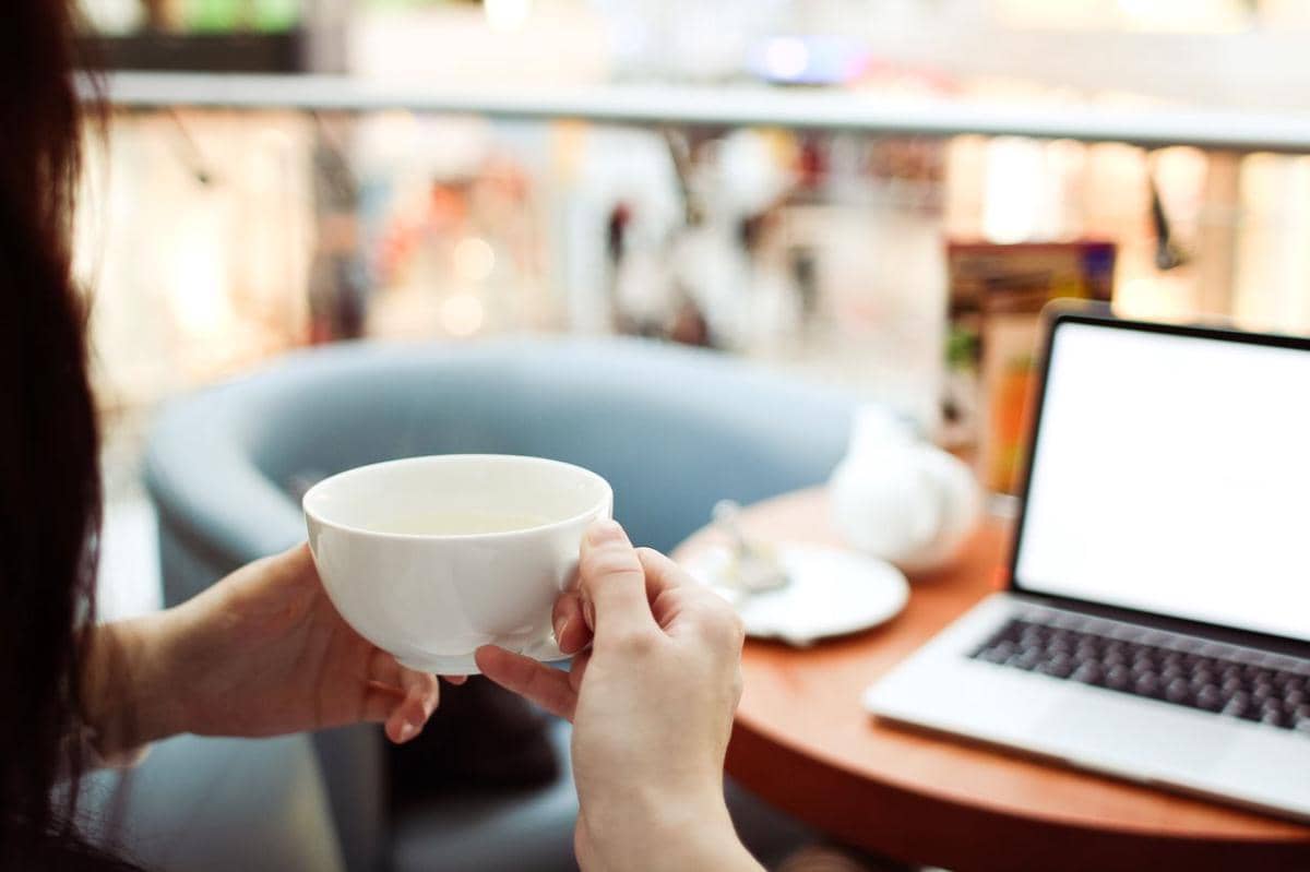 https://www.pexels.com/photo/person-holding-white-ceramic-teacup-in-front-of-a-macbook-pro-210658/