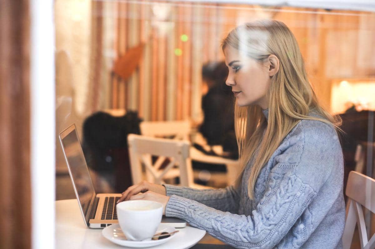 https://www.pexels.com/photo/serious-young-woman-using-netbook-while-having-hot-drink-in-modern-cafe-3766227/