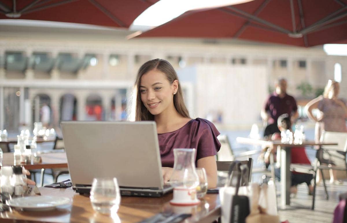 https://www.pexels.com/photo/woman-in-purple-shirt-sitting-by-the-table-using-macbook-3811593/