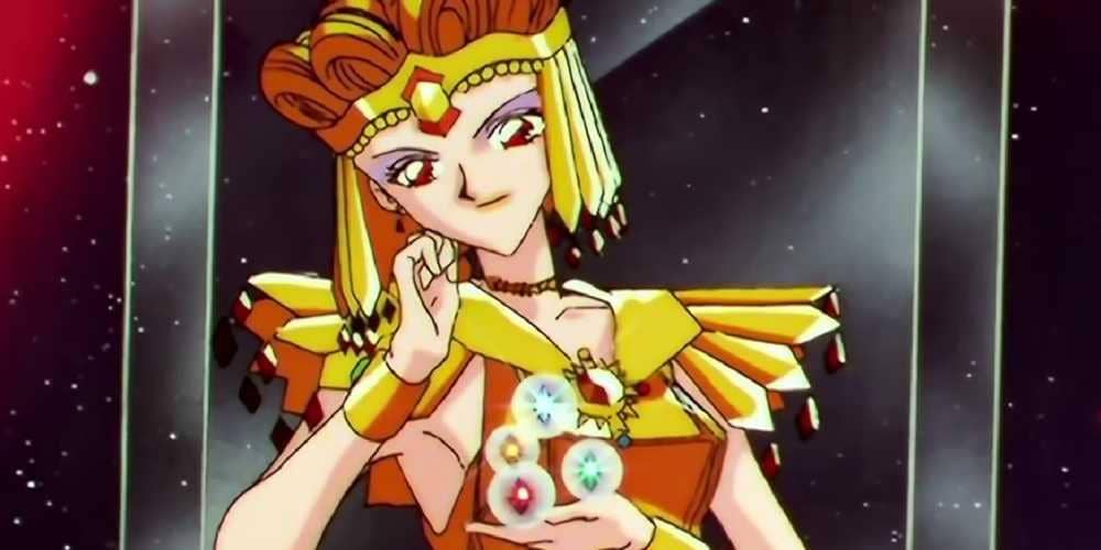 Sailor Galaxia mengenakan kostum emas dengan perhiasan berkilau di tangan, berlatar ruang angkasa yang gelap bertabur bintang.
